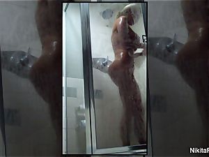 Home video of Nikita Von James taking a bathroom